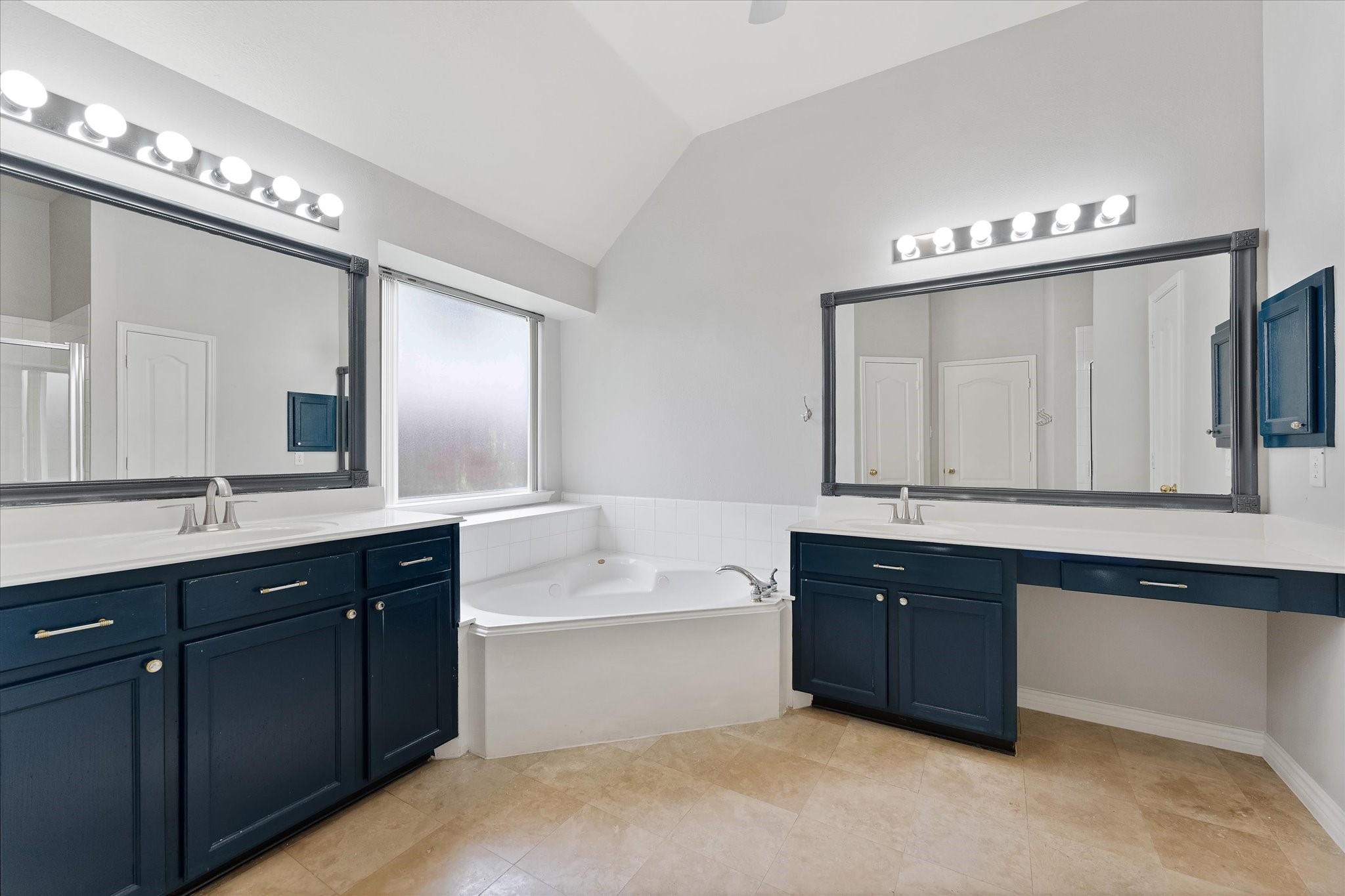 29823 Spring Terrace Drive Spring, TX 77386 - Photo 36 of 49 a spacious bathroom with a double vanity sink a large mirror and a bathtub
