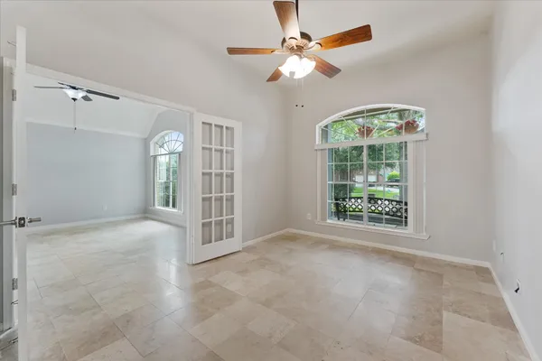 a view of an empty room with a window