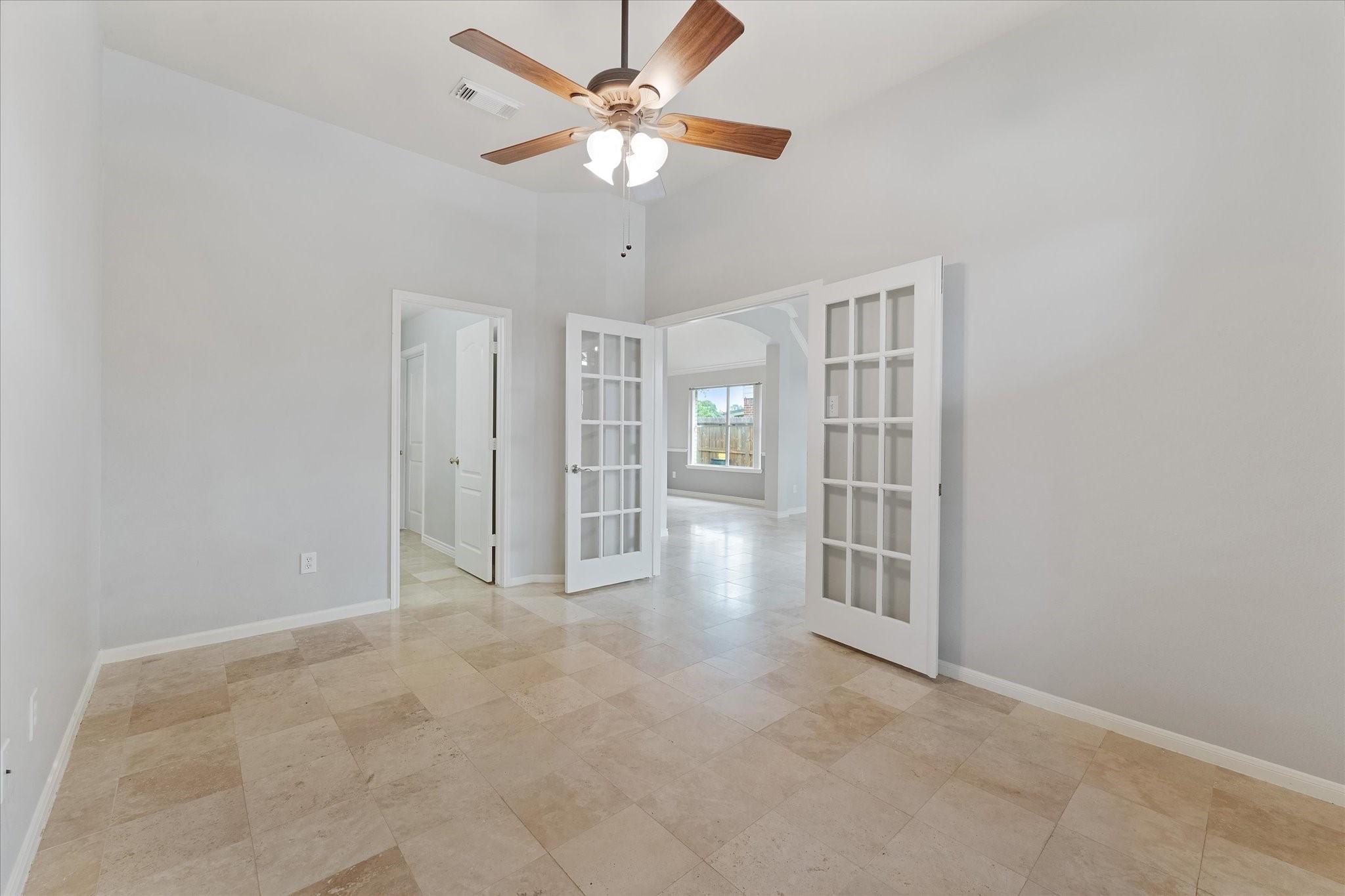 29823 Spring Terrace Drive Spring, TX 77386 - Photo 9 of 49 an empty room with chandelier fan and windows