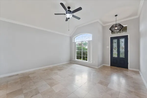 a kitchen with granite countertop a sink stove and refrigerator