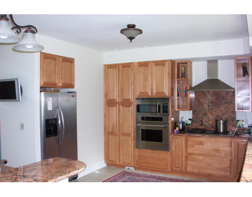 3235 Mountain Road Suffield, CT 06093 - Photo 5 of 11 a kitchen with stainless steel appliances kitchen island granite countertop a refrigerator oven a sink and dishwasher