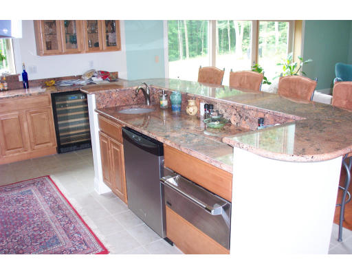 3235 Mountain Road Suffield, CT 06093 - Photo 6 of 11 a kitchen with stainless steel appliances granite countertop a sink stove and cabinets