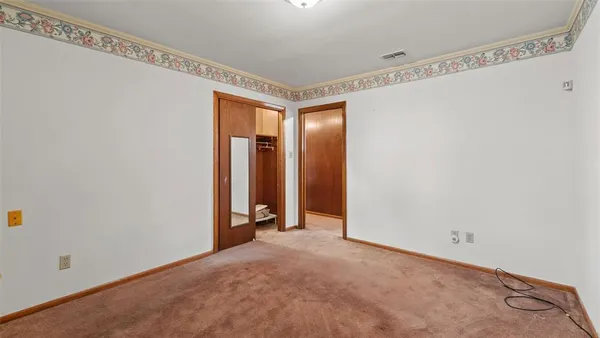 a view of a patio with a table chairs and a patio