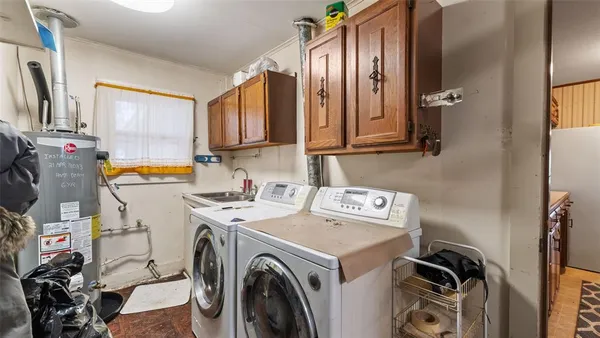 a view of a house with a yard covered in snow