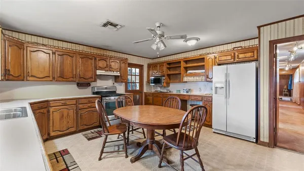a dining room with furniture window and wooden floor