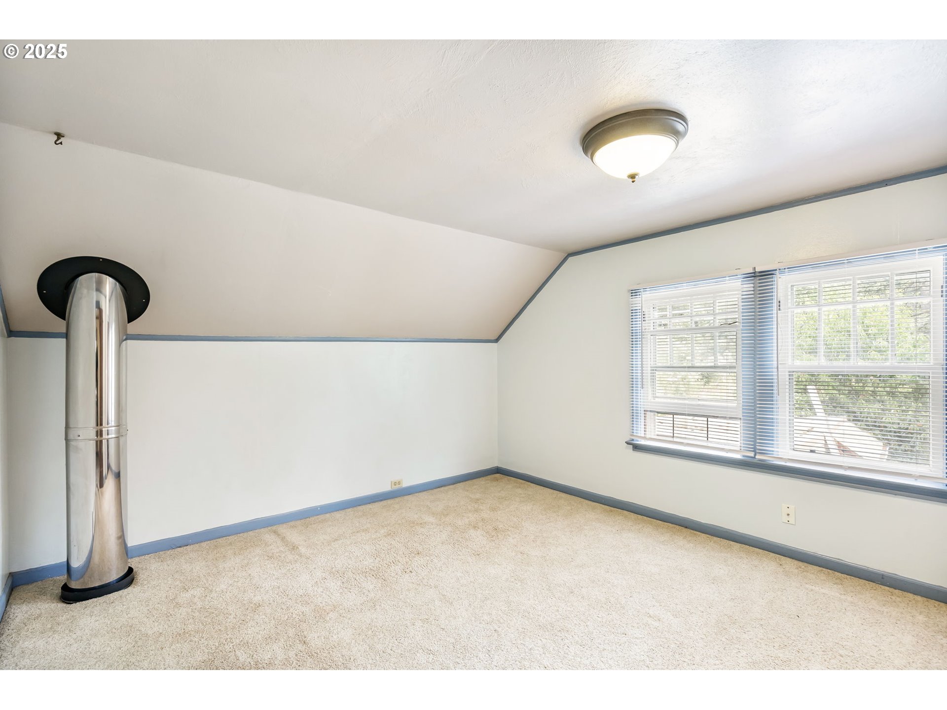51557 Southwest Em Watts Road Scappoose, OR 97056 - Photo 19 of 40 a view of an empty room with a window