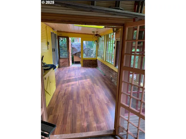 a view of a house with a wooden deck