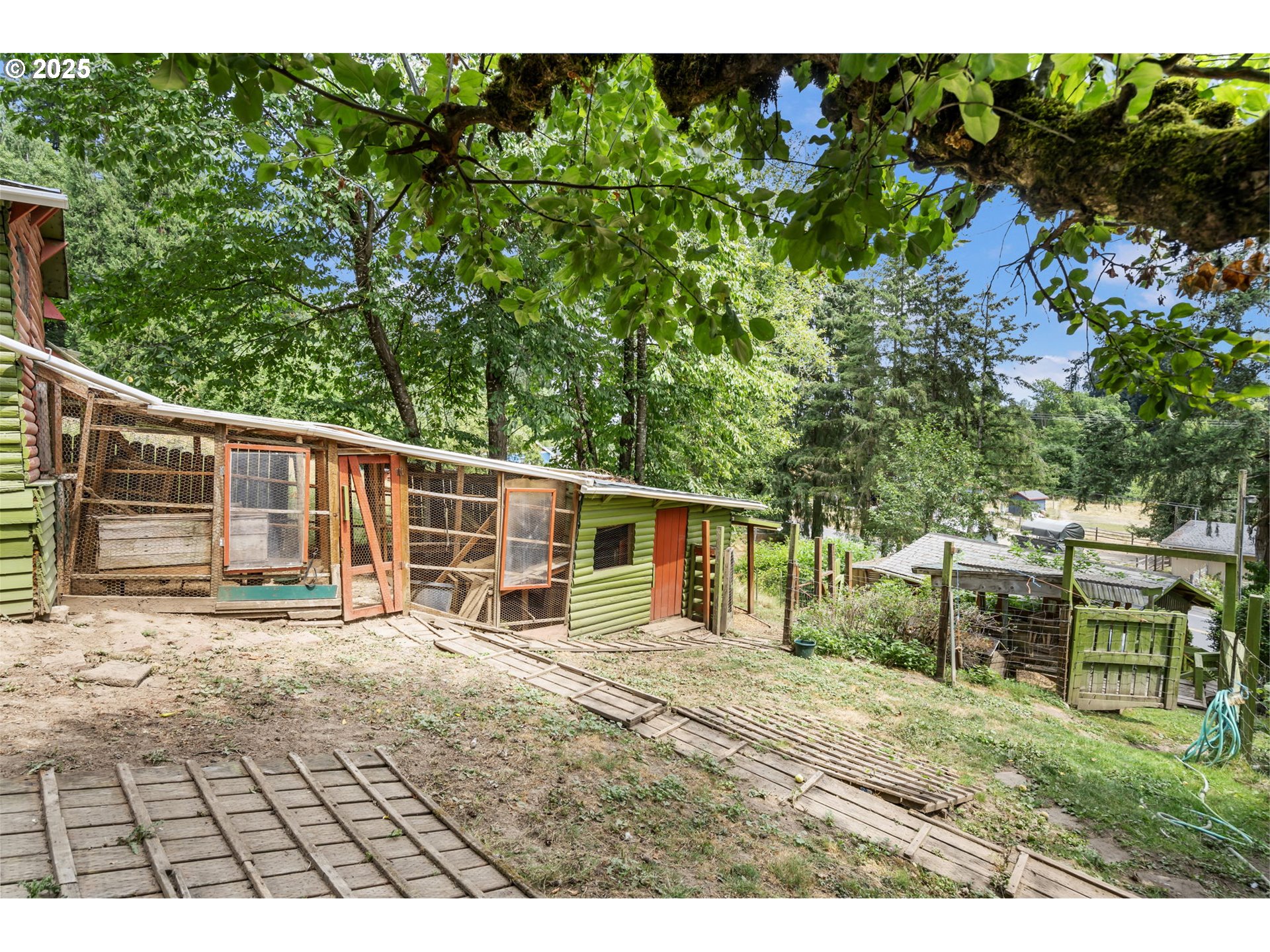 51557 Southwest Em Watts Road Scappoose, OR 97056 - Photo 33 of 40 a view of a house with a patio