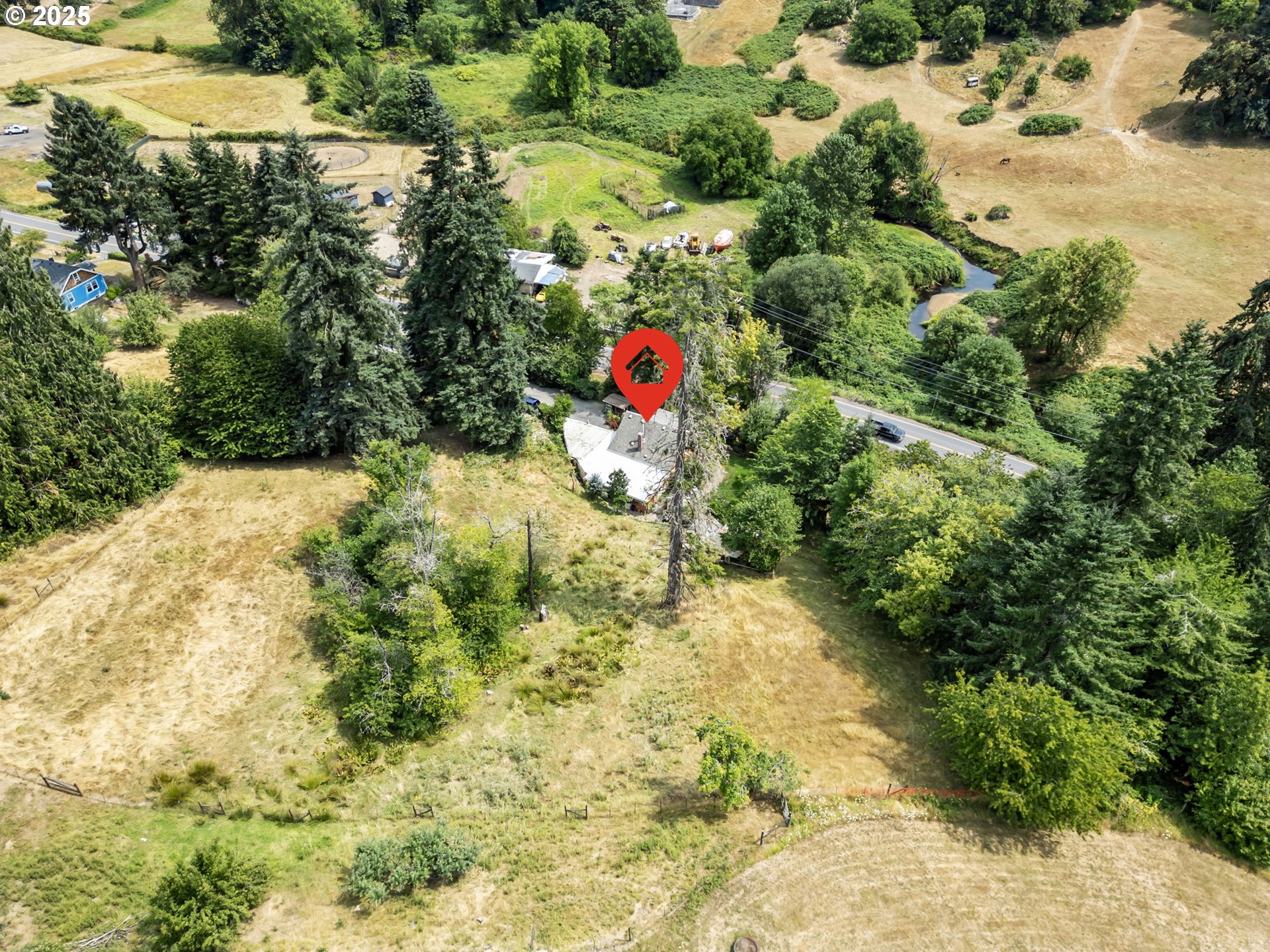 51557 Southwest Em Watts Road Scappoose, OR 97056 - Photo 38 of 40 a aerial view of a yard with plants and large trees