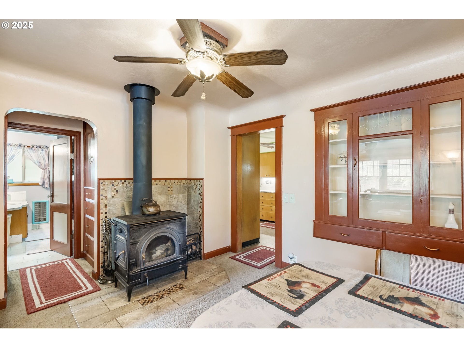 51557 Southwest Em Watts Road Scappoose, OR 97056 - Photo 7 of 40 a living room with furniture and a fireplace