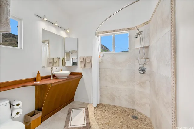 a view of a house with backyard sitting area and garden