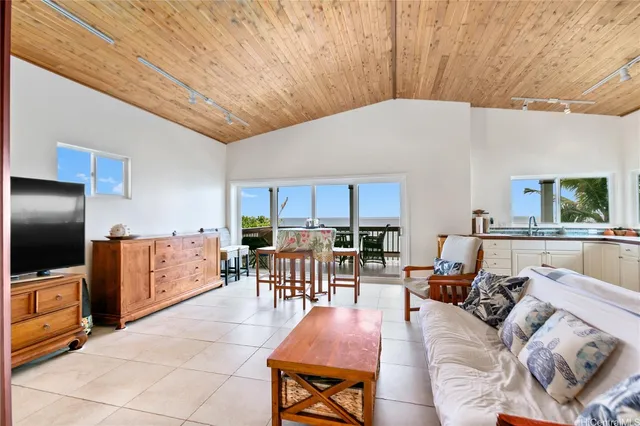 a bathroom with a tub sink toilet and shower