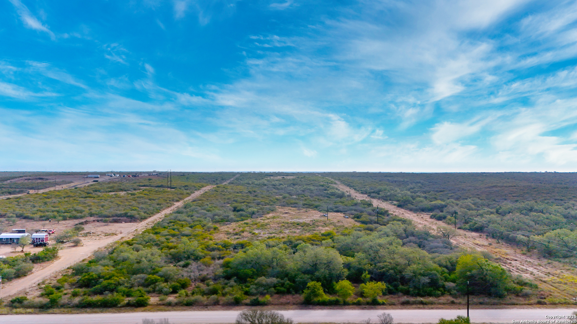 291 County Road 1670 Moore, TX 78057 - Photo 2 of 11 an aerial view of houses covered in trees