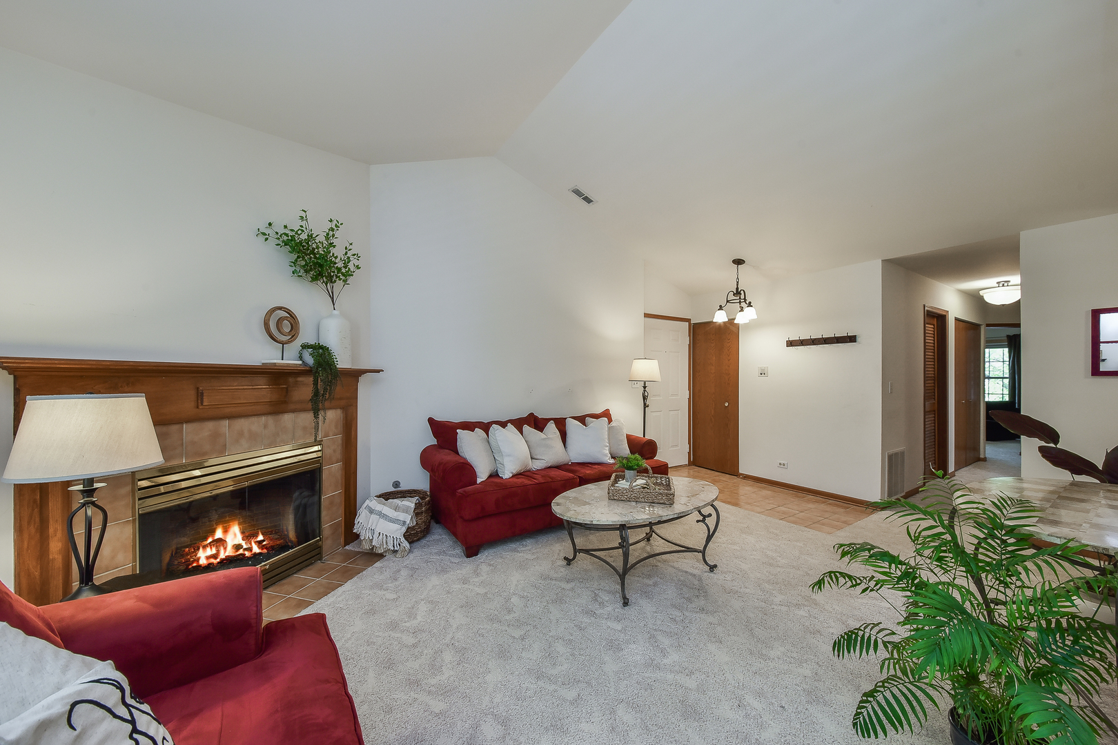 -n159 Windermere Road, Unit 1107 Winfield, IL 60190 - Photo 3 of 14 a living room with furniture and a fireplace