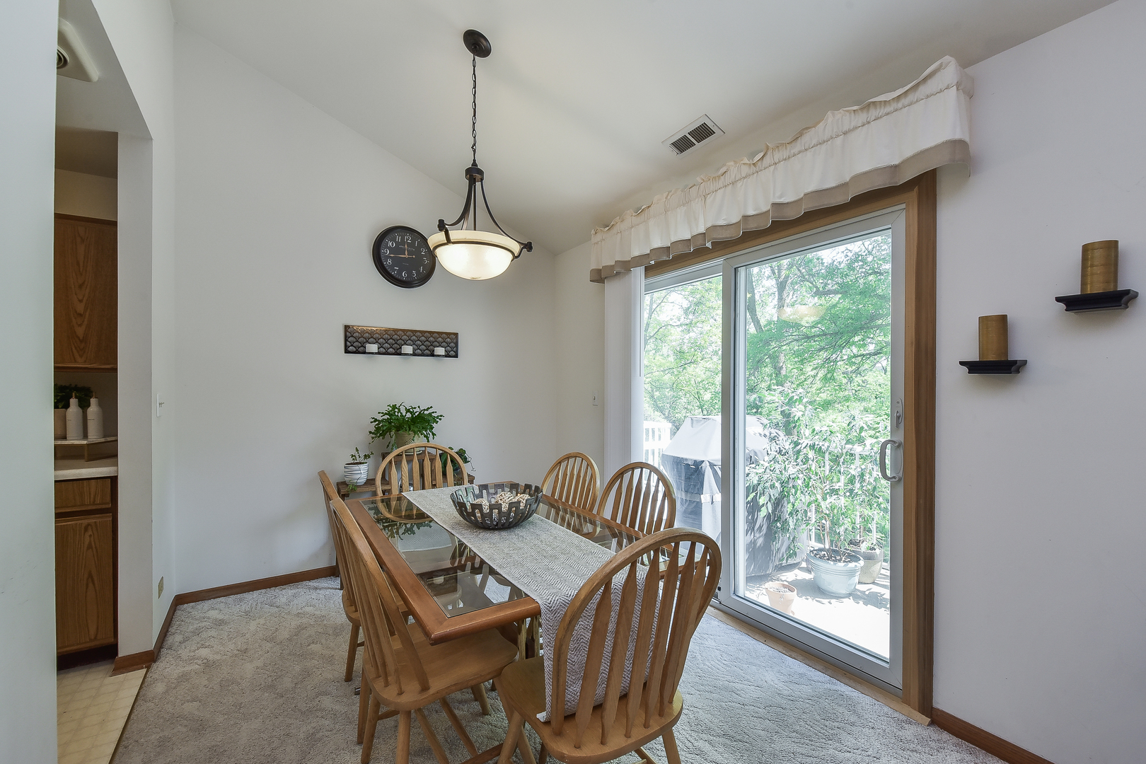 -n159 Windermere Road, Unit 1107 Winfield, IL 60190 - Photo 4 of 14 a view of a dining room with furniture window and outside view