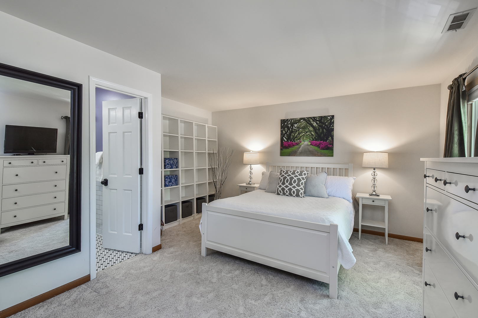 -n159 Windermere Road, Unit 1107 Winfield, IL 60190 - Photo 7 of 14 a bedroom with a bed and a television