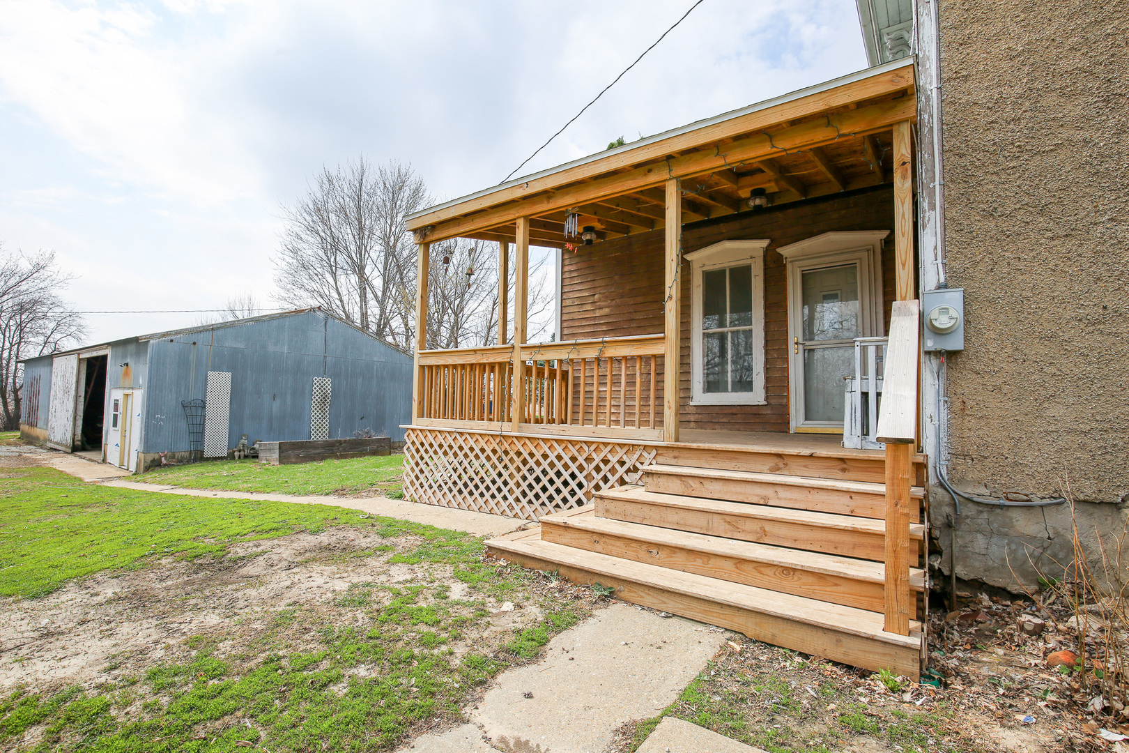 26596 Fairhaven Road Chadwick, IL 61014 - Photo 8 of 51 a front view of a house with a garden