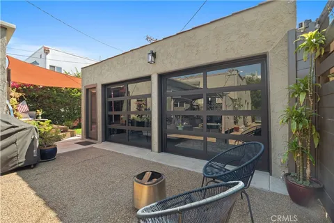 a outdoor living space with furniture and a potted plant