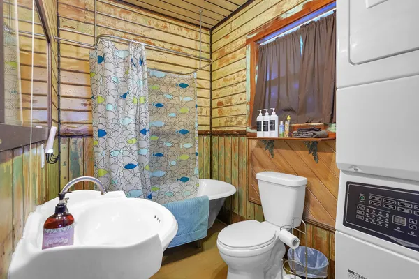 a kitchen with a refrigerator and a stove