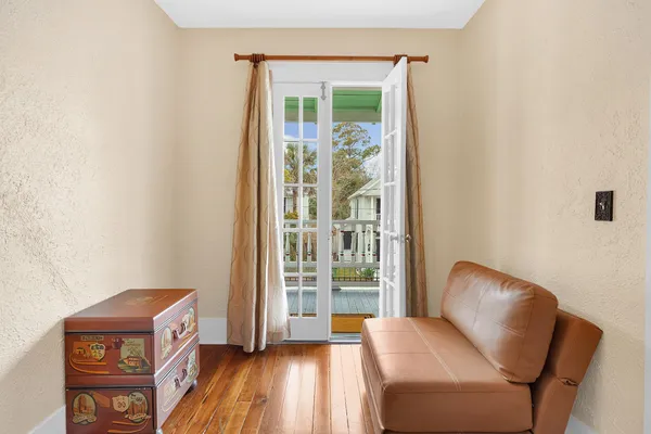 a bedroom with a bed and a table