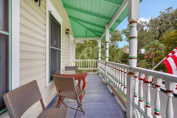a view of balcony with a potted plant and a bench