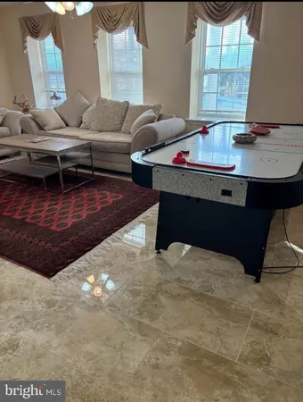 a living room with furniture and window
