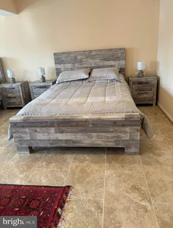 a bedroom with a bed and a table