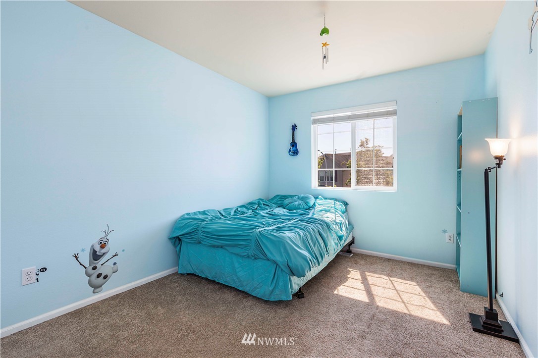 332 Index Avenue Southeast Renton, WA 98056 - Photo 17 of 23 a bedroom with a bed and a window
