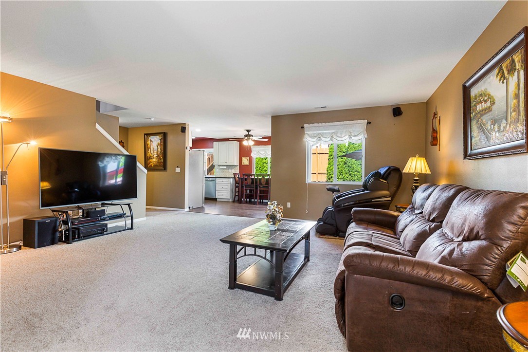 332 Index Avenue Southeast Renton, WA 98056 - Photo 5 of 23 a living room with furniture and a flat screen tv