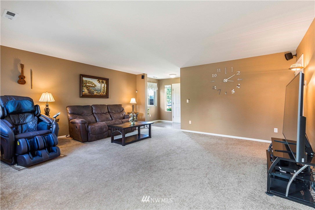 332 Index Avenue Southeast Renton, WA 98056 - Photo 6 of 23 a living room with furniture a couch and a flat screen tv