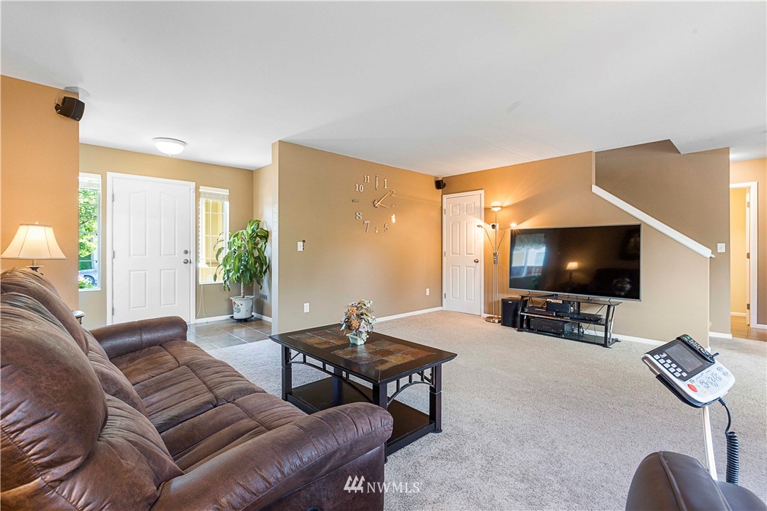 332 Index Avenue Southeast Renton, WA 98056 - Photo 7 of 23 a living room with furniture and a flat screen tv