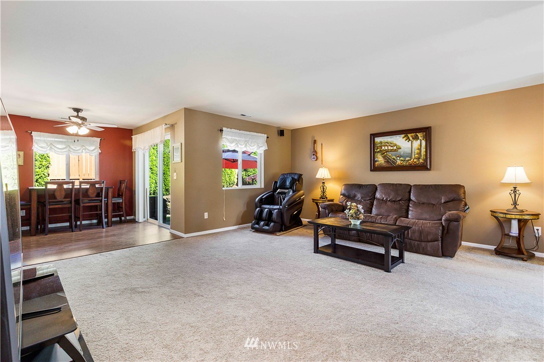 332 Index Avenue Southeast Renton, WA 98056 - Photo 8 of 23 a living room with furniture and a flat screen tv