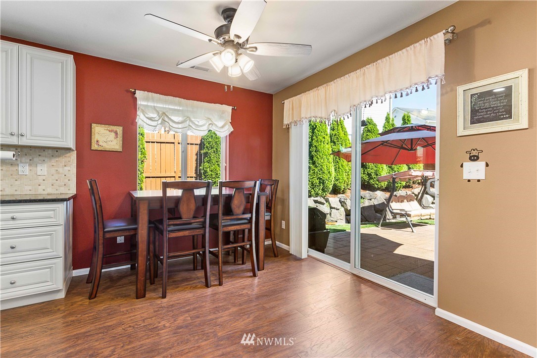 332 Index Avenue Southeast Renton, WA 98056 - Photo 9 of 23 a view of a dining room with furniture window and wooden floor