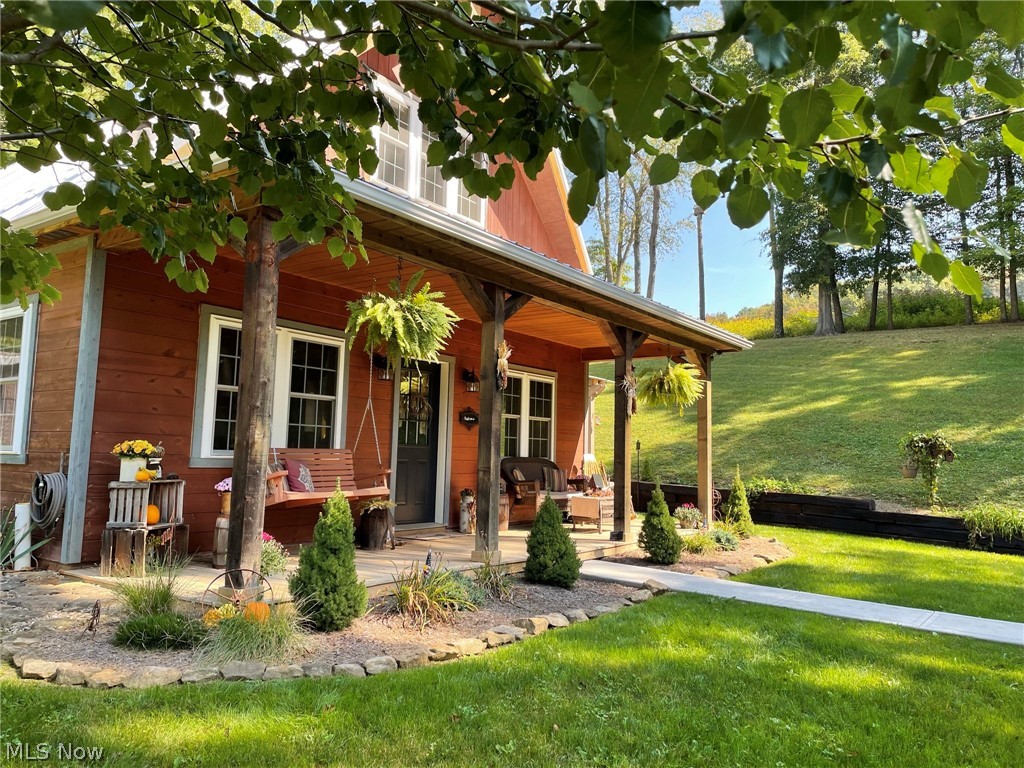 nicely landscaped with a large country porch