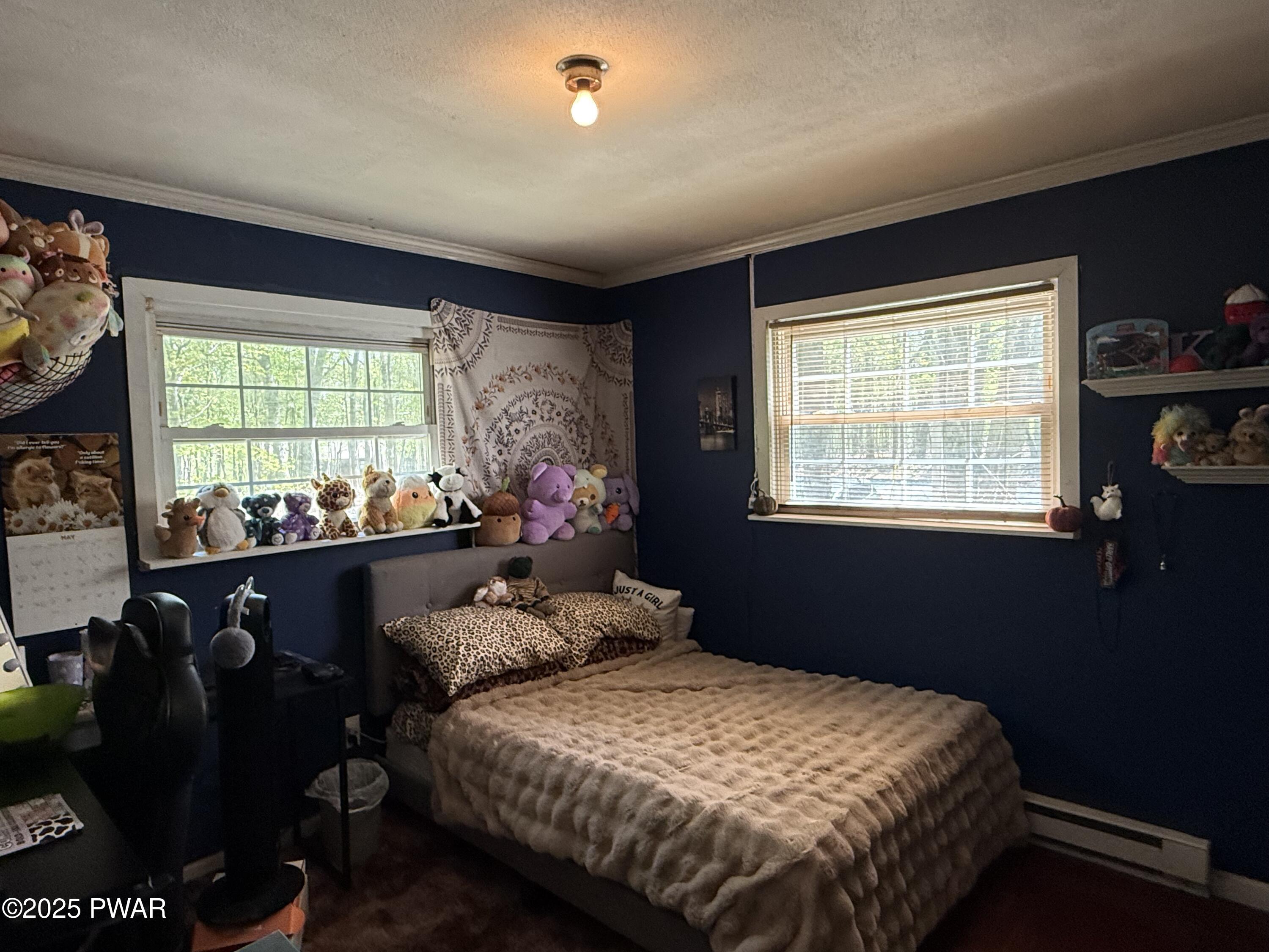 103 Stonehenge Road Milford, PA 18337 - Photo 16 of 20 a bed sitting in a bedroom next to a window