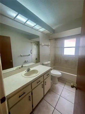 a bathroom with a sink toilet and tub