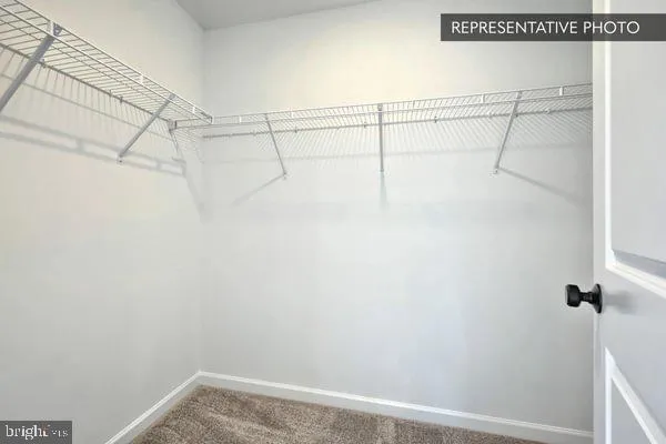 a bathroom with double sink and a mirror