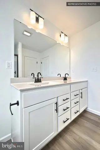 a view of hallway with wooden floor