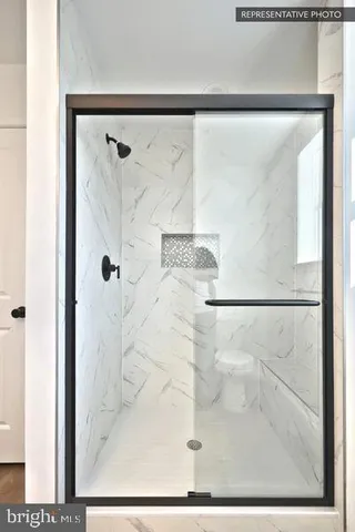 a view of hallway with wooden floor