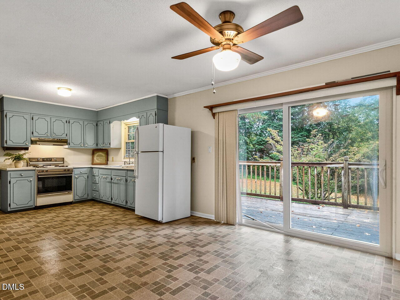 617 South Lakeside Drive Raleigh, NC 27606 - Photo 13 of 32 a kitchen with a refrigerator and a sink