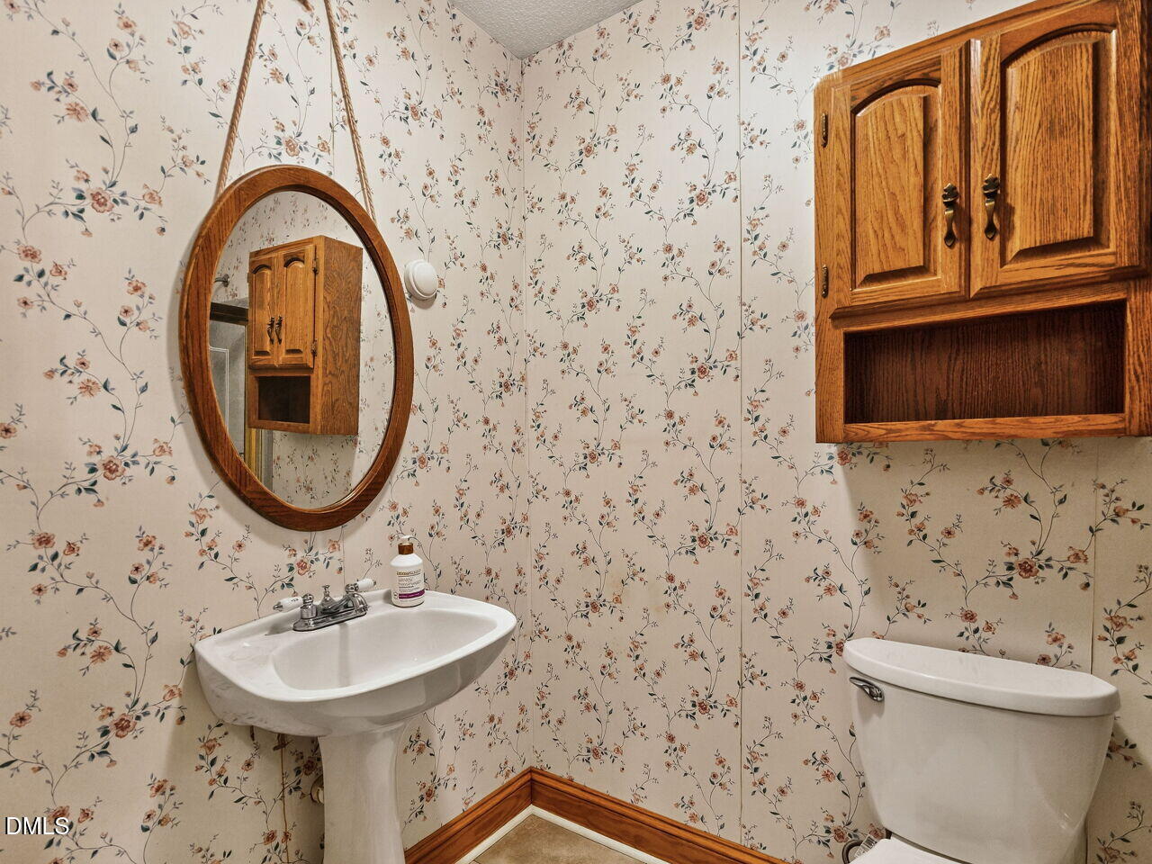 617 South Lakeside Drive Raleigh, NC 27606 - Photo 15 of 32 a bathroom with a sink and a mirror