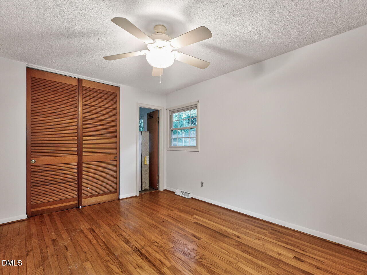 617 South Lakeside Drive Raleigh, NC 27606 - Photo 16 of 32 wooden floor in an empty room with a window