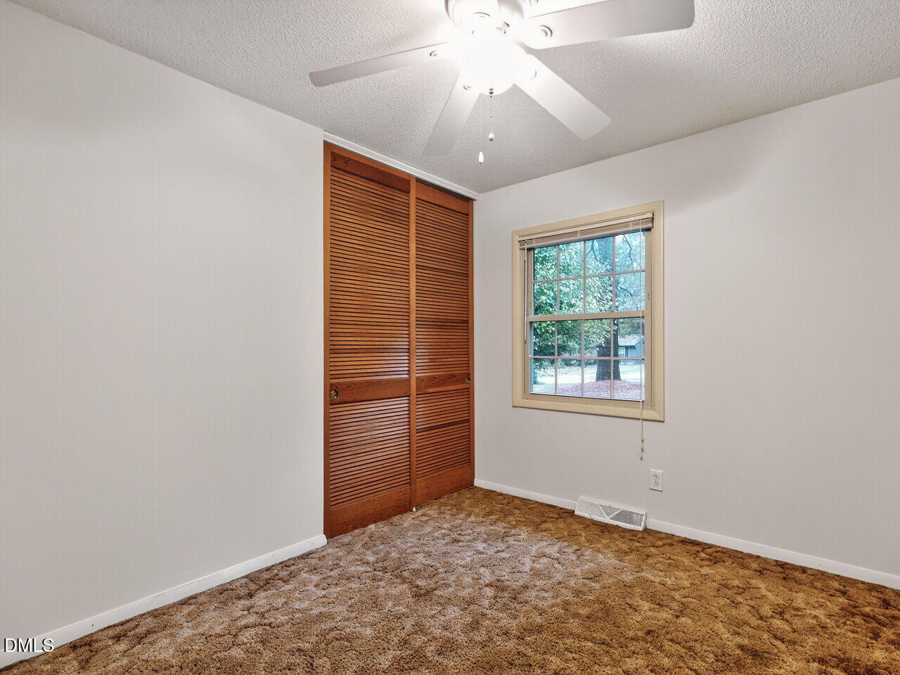 617 South Lakeside Drive Raleigh, NC 27606 - Photo 19 of 32 an empty room with windows and closet