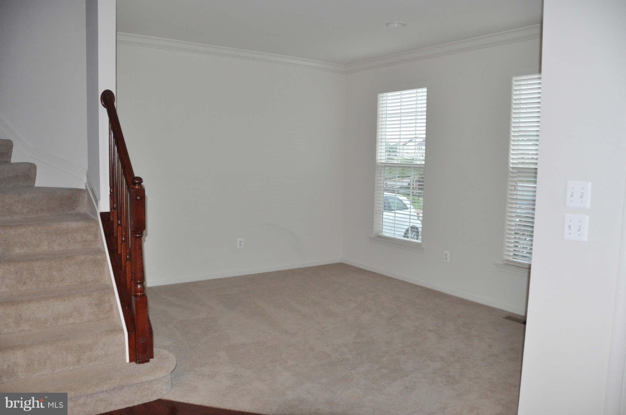 6627 Pebble Brooke Road Baltimore, MD 21209 - Photo 11 of 12 an empty room with windows