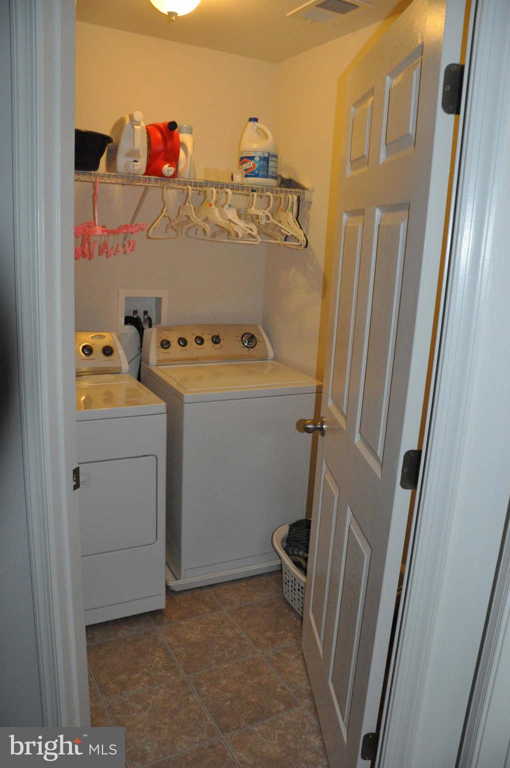 6627 Pebble Brooke Road Baltimore, MD 21209 - Photo 8 of 12 a utility room with dryer and washer