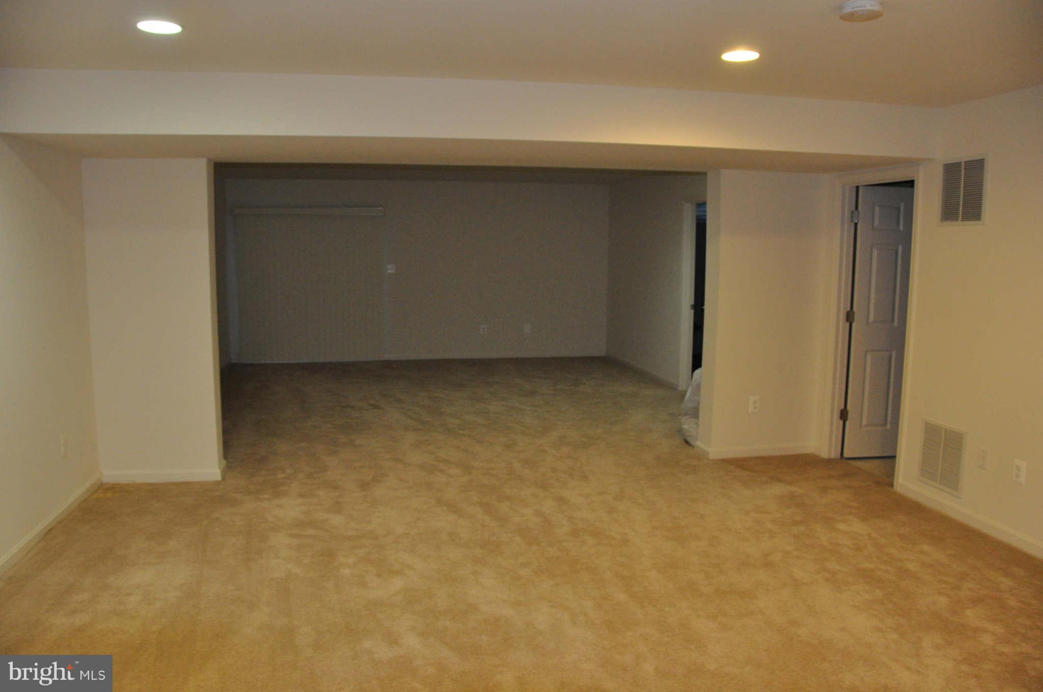 6627 Pebble Brooke Road Baltimore, MD 21209 - Photo 10 of 12 a view of an empty room with a window