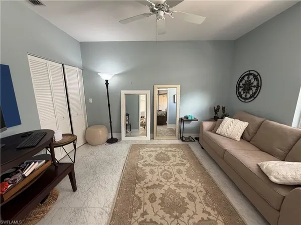 a living room with furniture and a window