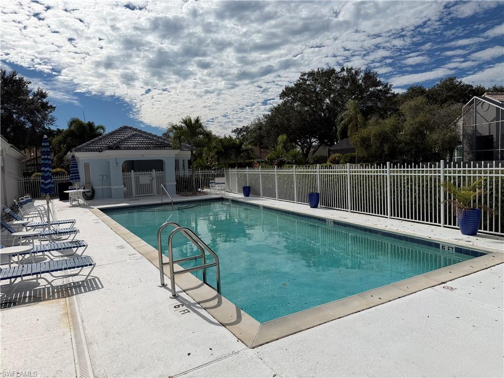 5950 Almaden Drive Naples, FL 34119 - Photo 40 of 41 a view of a house with a yard