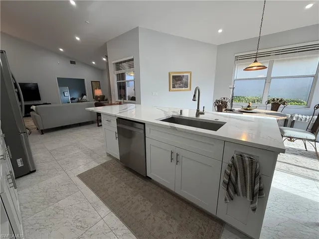 a kitchen with a sink and cabinets