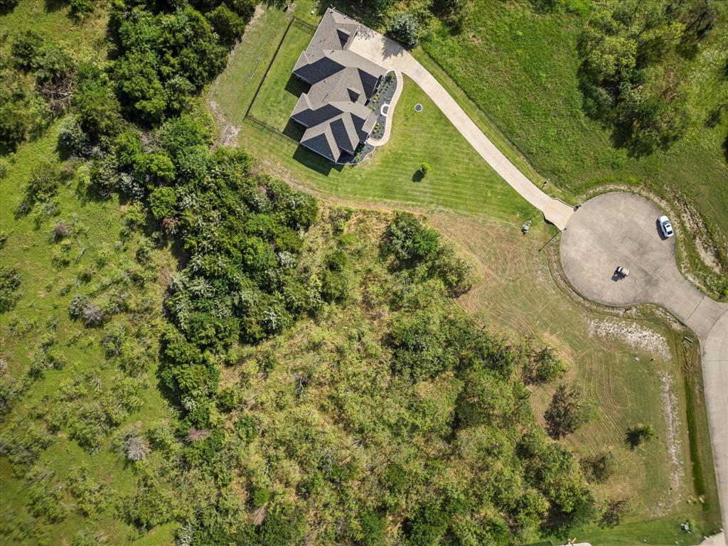 540 Austin Circle, Unit B Terrell, TX 75160 - Photo 3 of 11 a view of a back yard of the house